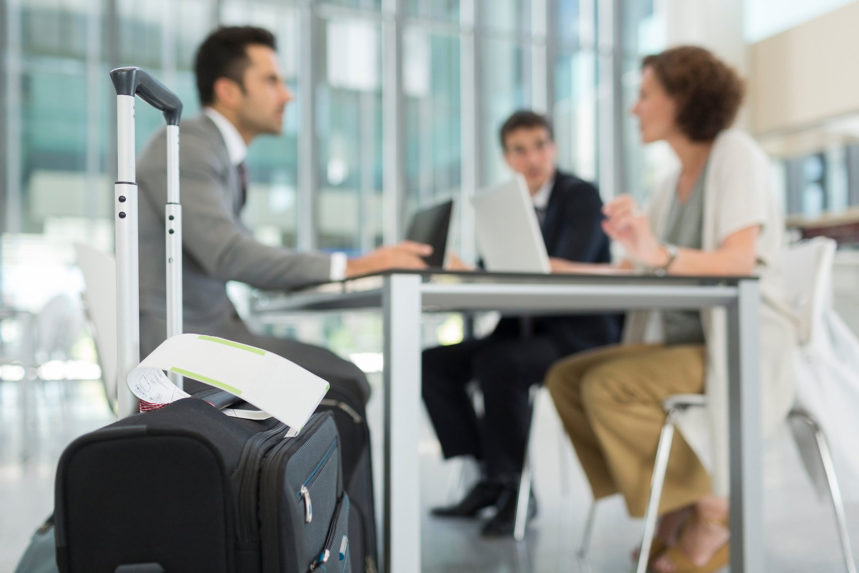 Businss meeting in airport's terminal before traveling.